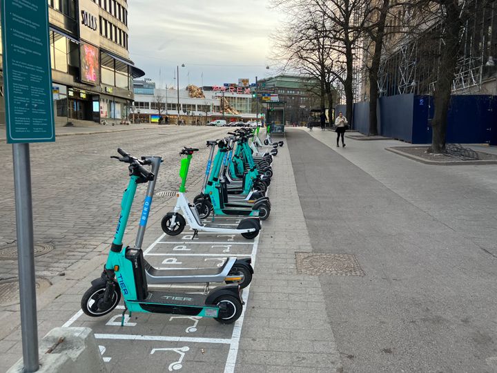 Electric scooters parked in the city centre in summer 2022.