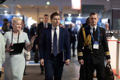 Finland’s Minister of Defence, Antti Häkkänen (in the middle) exploring the exhibition with the Secretary General, Mrs Tuija Karanko of the Association of Finnish Defence and Aerospace Industries (PIA).