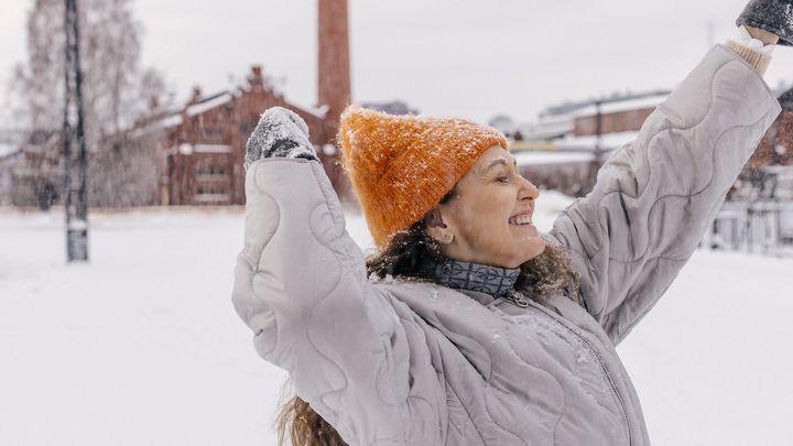 Woman outside in winter wearing winter clothes.