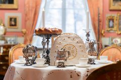 A beautifully set Christmas table with silver coffee set and pastries.