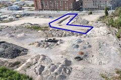 Flygfoto över byggområdet. Långholmsgatan är belägen på oljehamnens sandplan.