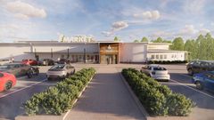 Auringonpaisteessa ABC Keljonkankaan uudistettu ravintola ja uusi S-market, jossa on pysäköityjä autoja edessä.