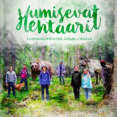 Kuva esittää ihmisiä ja eläimiä metsässä, ja siinä on teksti: "Humisevat hehtaarit - Luonnonperintöä suojelemassa".