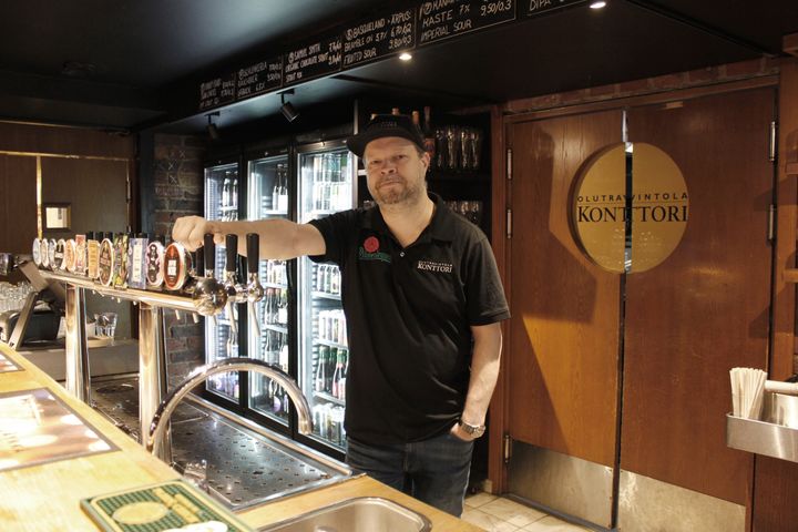 bartender and beer taps, wooden desk