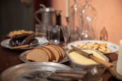 The liquor table set with bread and butter, pretzels, herring and sausages served in particular guests who had arrived from further away.