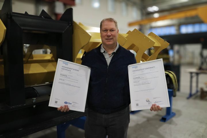 In this picture, Ferroplan's CEO, Antti Rousku stands in the production hall with the new certificates in his hands.