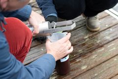 Prof Jens Tränckner and his research assistant Alena Seidenfaden from the University of Rostock take water samples from the Warnow at the jetty of the Olympic rowing centre south of Rostock / EU4Regions